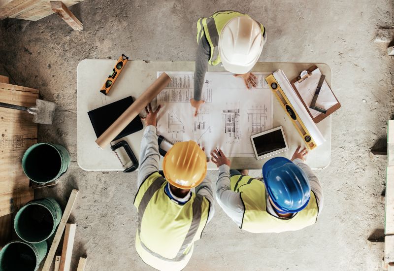 Project Management Team Discussing Plans at a Commercial Construction Site in South Central Wisconsin